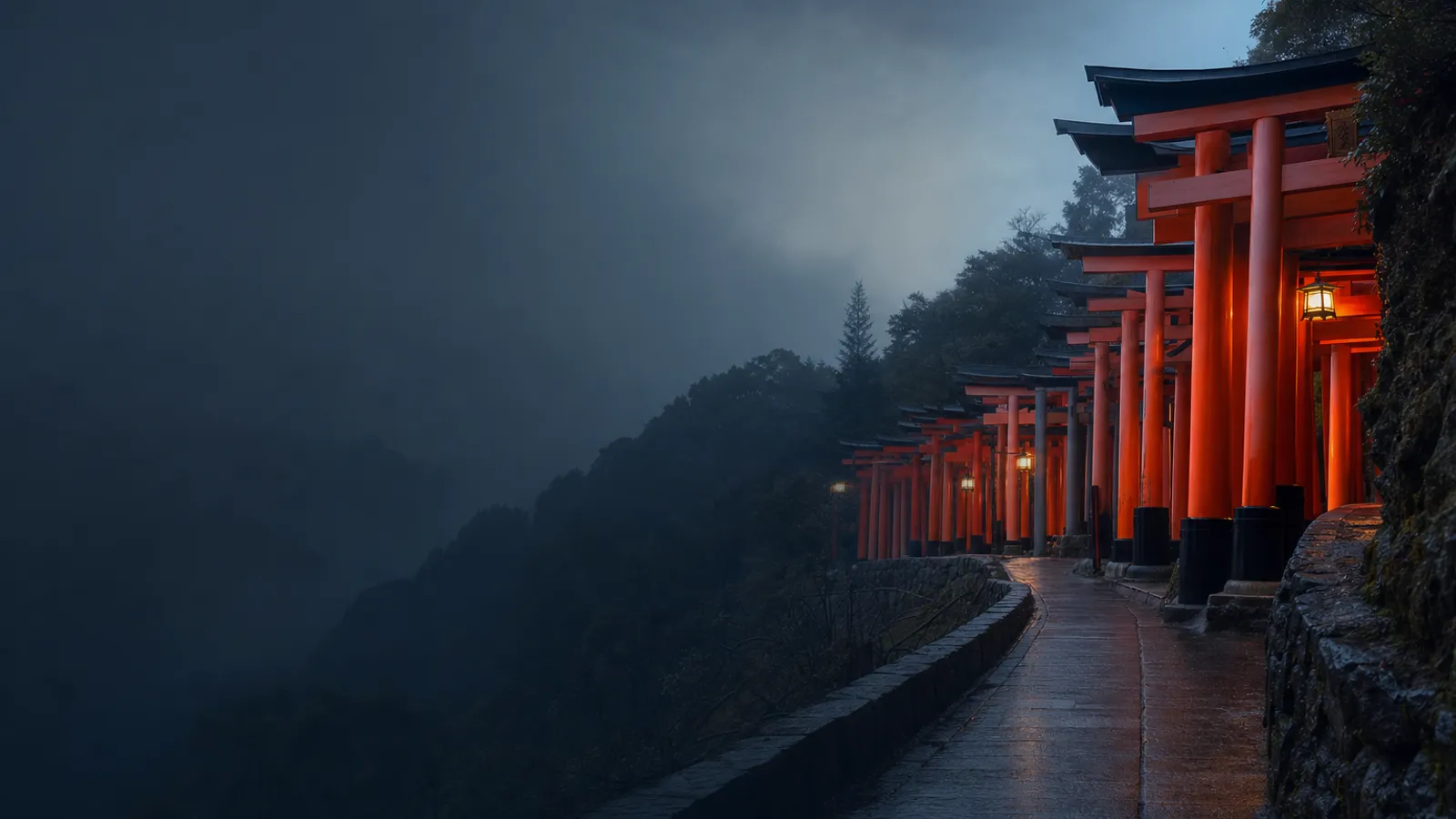 Tunnel of vermilion torii gates at dawn