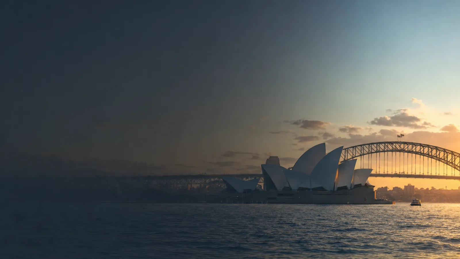 Sydney Opera House sails and the harbour bridge at golden hour