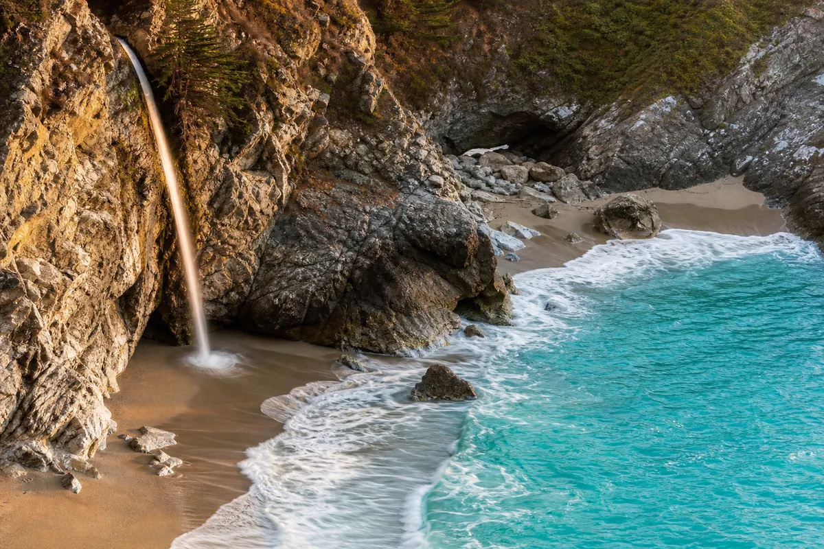McWay Falls dropping onto the beach cove, Julia Pfeiffer Burns State Park, Big Sur