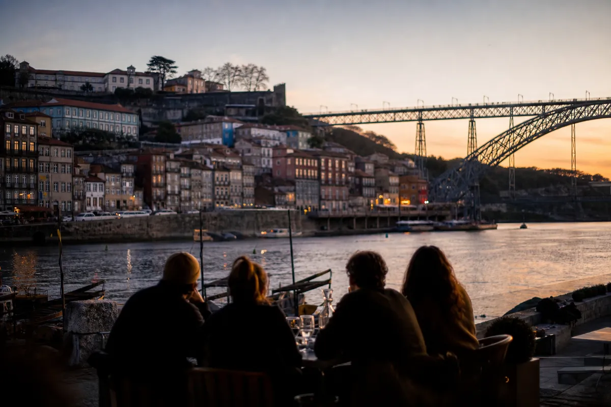 The Ribeira riverfront and the Dom Luís bridge over the Douro at golden hour, Porto